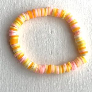 Handmade bracelet clay bead orange/pink/white stretchy